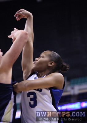 Shay Selby is fouled by Brigitte Ardossi in the act of shooting a three pointer.  Her two made free throws not only broke a 43-43 tie, but gave Duke the lead for good. -  - 