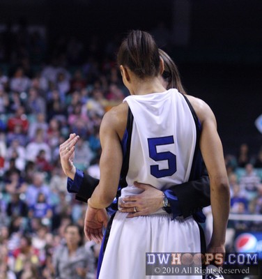 Coach P counsels her point guard Jasmine Thomas during a short break in the action -  - 
