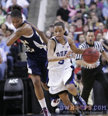Despite the best efforts of Deja Foster (left), Duke's Jasmine Thomas gets the steal and is off to the races -  - 