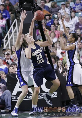 Allison Vernerey (left) and Jasmine Thomas (right) turn over Brigitte Ardossi in the lane -  - 