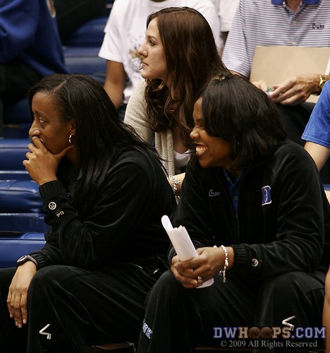 2009 graduate Abby Waner (middle) watches from behind Duke's assistant coaches Samantha Williams and Trisha Stafford-Odum. -  - 
