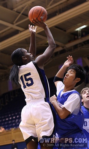 Bridgette Mitchell measures a shot -  - 