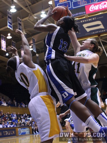 After a steal, Karima Christmas drives and is fouled by UAA's Kelsie Gourdin -  - 