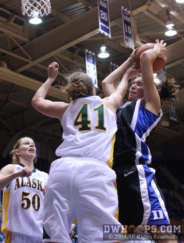 A fierce battle in the paint between Kelsie Gourdin (41) and Allison Vernerey -  - 