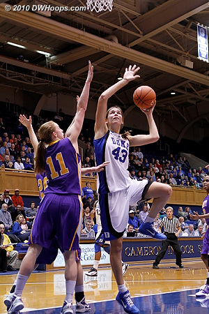 Allison Vernerey tries a left handed shot against Julie Forster.