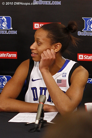 Jas in the media room, hearing high praise from her coach.