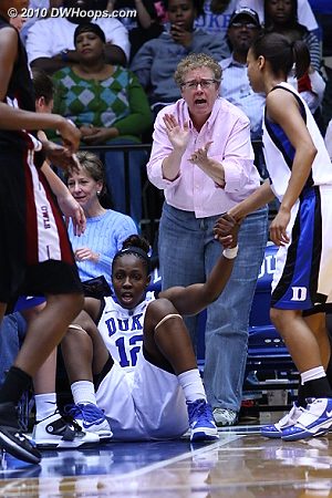 The ever-intense Kathy Kennedy applauds from the first row of floor seats after Chelsea Gray drew a charge from Shey Peddy.