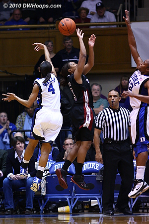 Chloe Wells swats a BJ Williams shot into the stands.