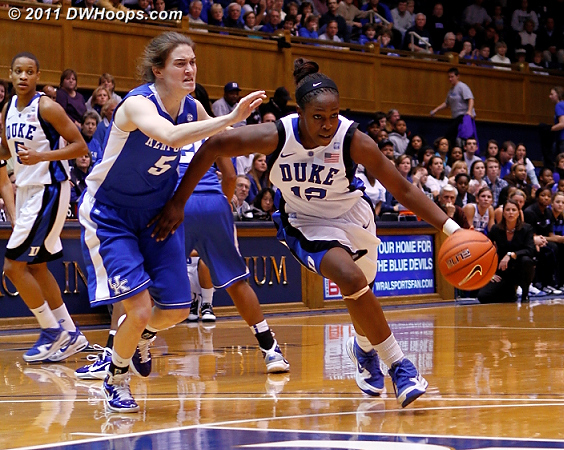 Chelsea Gray drives past Kentucky's Carly Morrow.  - Duke Tags: #12 Chelsea Gray 