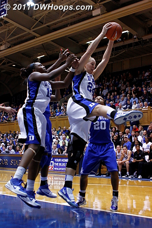 Kathleen Scheer pulls down an offensive rebound.