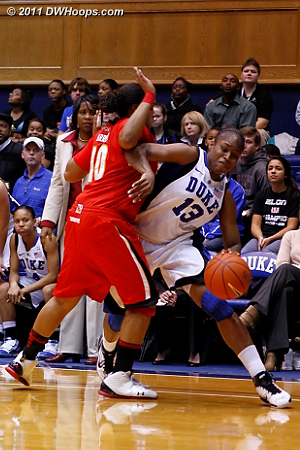 Karima Christmas draws a foul from Anjale Barrett.  - Duke Tags: #13 Karima Christmas 