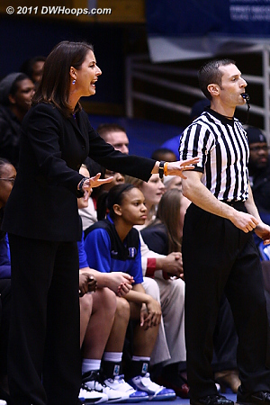 Coach P looks for Duke to settle down as referee Joseph Vaszily watches play continue.