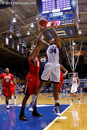 Alicia DeVaughn elevates to block a Krystal Thomas shot  