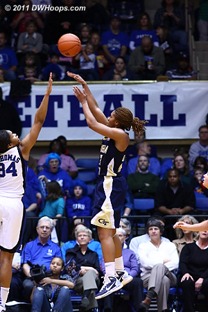 Alex Montgomery shoots over Krystal Thomas  