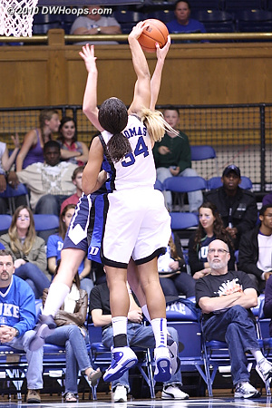 Krystal Thomas gets what looks like a clean block, one can only imagine that the foul was called due to contact from her other hand or the body.  - Duke Tags: #34 Krystal Thomas 