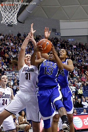 Karima yanks an offensive board down, just out of the clutches of Stefanie Dolson (31)  - Duke Tags: #13 Karima Christmas 