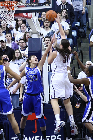 Dolson goes up to score over Haley Peters  - Duke Tags: #33 Haley Peters 