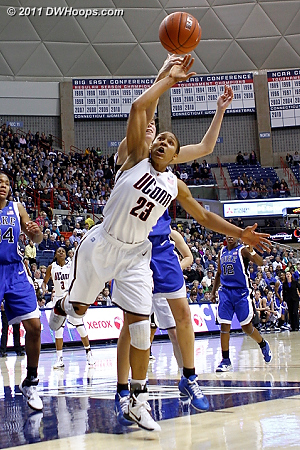 Maya Moore outduels Allison Vernerey for a rebound  