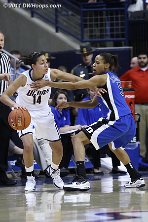 Jasmine Thomas extends the hand of friendship to Bria Hartley, who returns the gesture  - Duke Tags: #5 Jasmine Thomas 