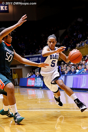 A determined Jasmine Thomas drives on Maria Brown.  Thomas would not score in the first half.  - Duke Tags: #5 Jasmine Thomas 