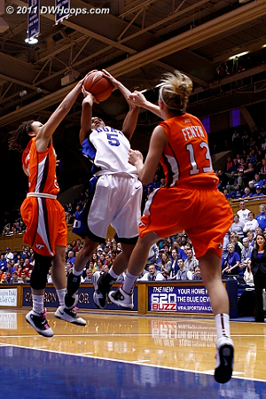 Jas comes up on the wrong end of a one on two break, her shot blocked by Kyani White  