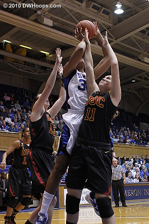Krystal Thomas goes strong against Kari Laplante (left) and Cassie Harberts.  