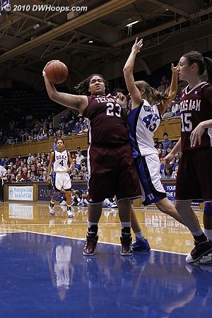 The powerful Danielle Adams reels in a defensive rebound.  