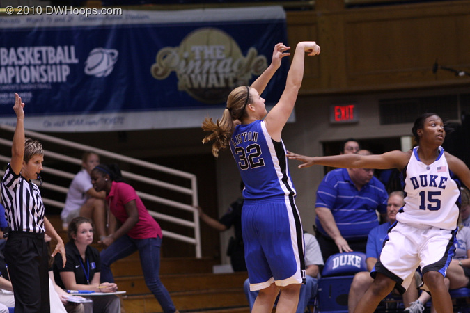 Tricia Liston fires a three over Richa Jackson.
