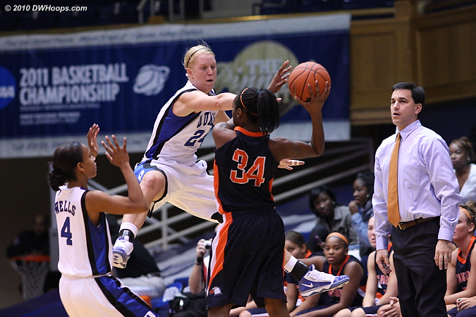 Kathleen Scheer gets in the face of Courdne Miles as Dean Walsh looks on