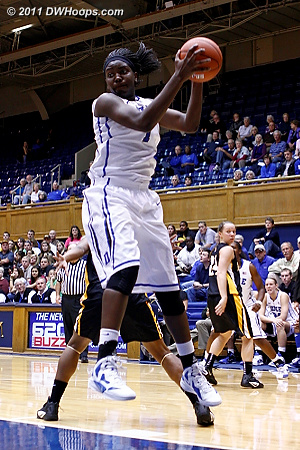Elizabeth Williams gathers one of seven offensive rebounds