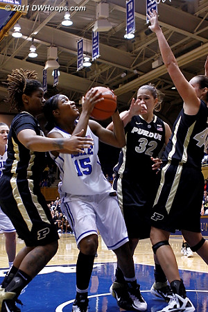 Richa in the middle of a triple team down low, drawing a foul  - Duke Tags: #15 Richa Jackson 
