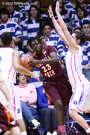 Hall hemmed in on the baseline  - Duke Tags: #33 Haley Peters - VT Players: #23 Larryqua Hall 