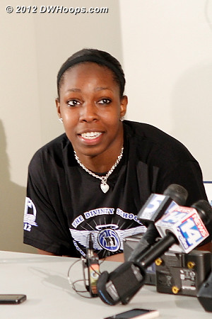 Chelsea taking a question in her very nice Duke Divinity School shirt