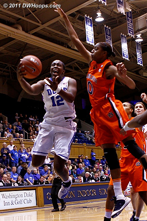 Chelsea Gray tries to shoot as Hasina Muhammad (0) looms