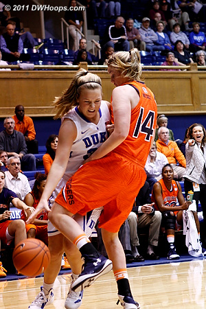 Tricia Liston and Blanche Alverson (14) collide