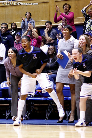 Ka'lia Johnson and Jenna Frush (right) cheer from the bench