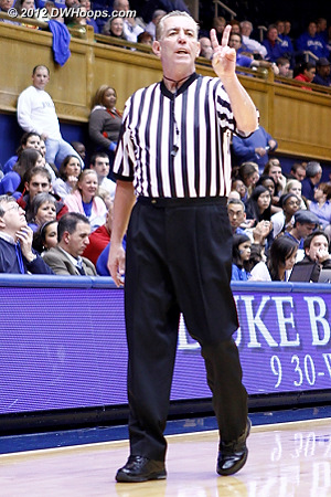 Referee Dennis DeMayo signals two shots for Elizabeth Williams  