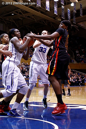 Lynetta Kizer tries to grab the ball from Elizabeth Williams' hands  - Duke Tags: #1 Elizabeth Williams 