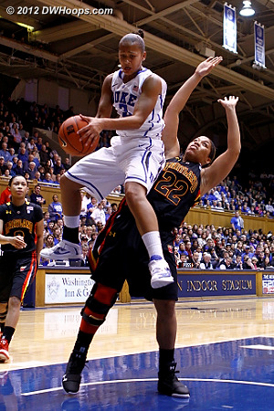 Shay Selby grabs a key offensive rebound and comes down on Kim Rodgers