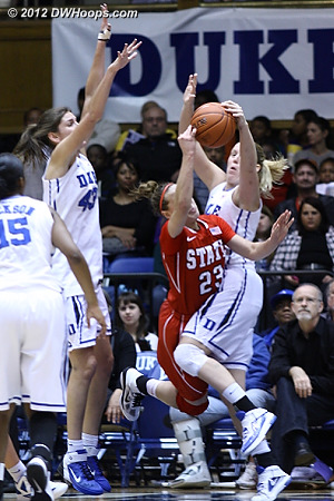 Kathleen Scheer blocks Marissa Kastanek's shot