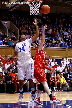 Johnson and Kastanek battle for a rebound