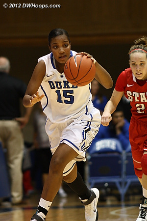 Richa Jackson heads downcourt after getting a steal, trailed by Marissa Kastanek