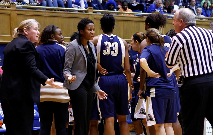 Patty Coyle (left) and Khadija Head ask Lawson Newton just who will be inbounding the ball  