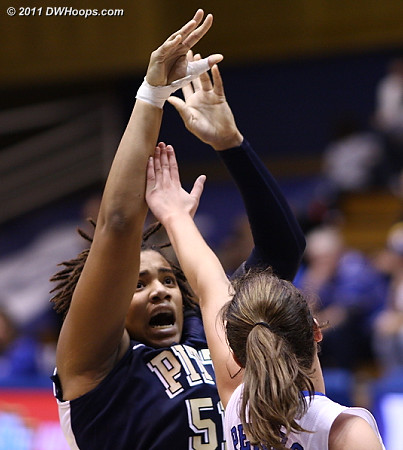 Cora McManus shoots over Haley Peters  