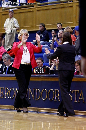 Coach P about to answer a perhaps unexpected high five from Coach B as the final seconds ticked off.  - Duke Tags: Joanne P. McCallie 