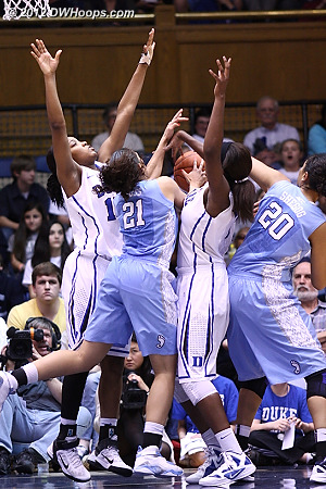 A battle for the ball  - Duke Tags: #1 Elizabeth Williams, #15 Richa Jackson - UNC Players: #20 Chay Shegog, #21 Krista Gross 