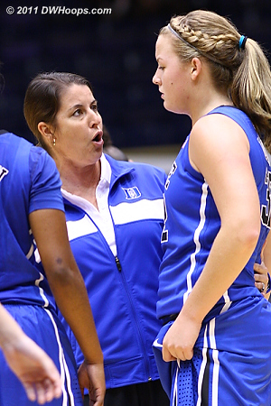 Coach P hops onto the floor during a break for a word with Liston  - Duke Tags: Joanne P. McCallie, #32 Tricia Liston 