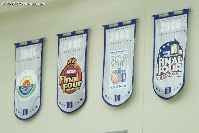 Final Four banners for both men's and women's basketball are prominently displayed in the K Center gym  