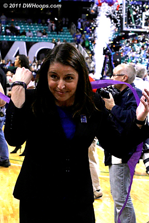 Coach P dodges the streamers falling from above  - Duke Tags: Joanne P. McCallie 
