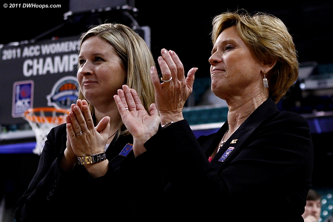 The ACC's Amy Yakola and Nora Lynn Finch applaud the champions.  We at DWHoops applaud them for yet another job well done with this tournament!  